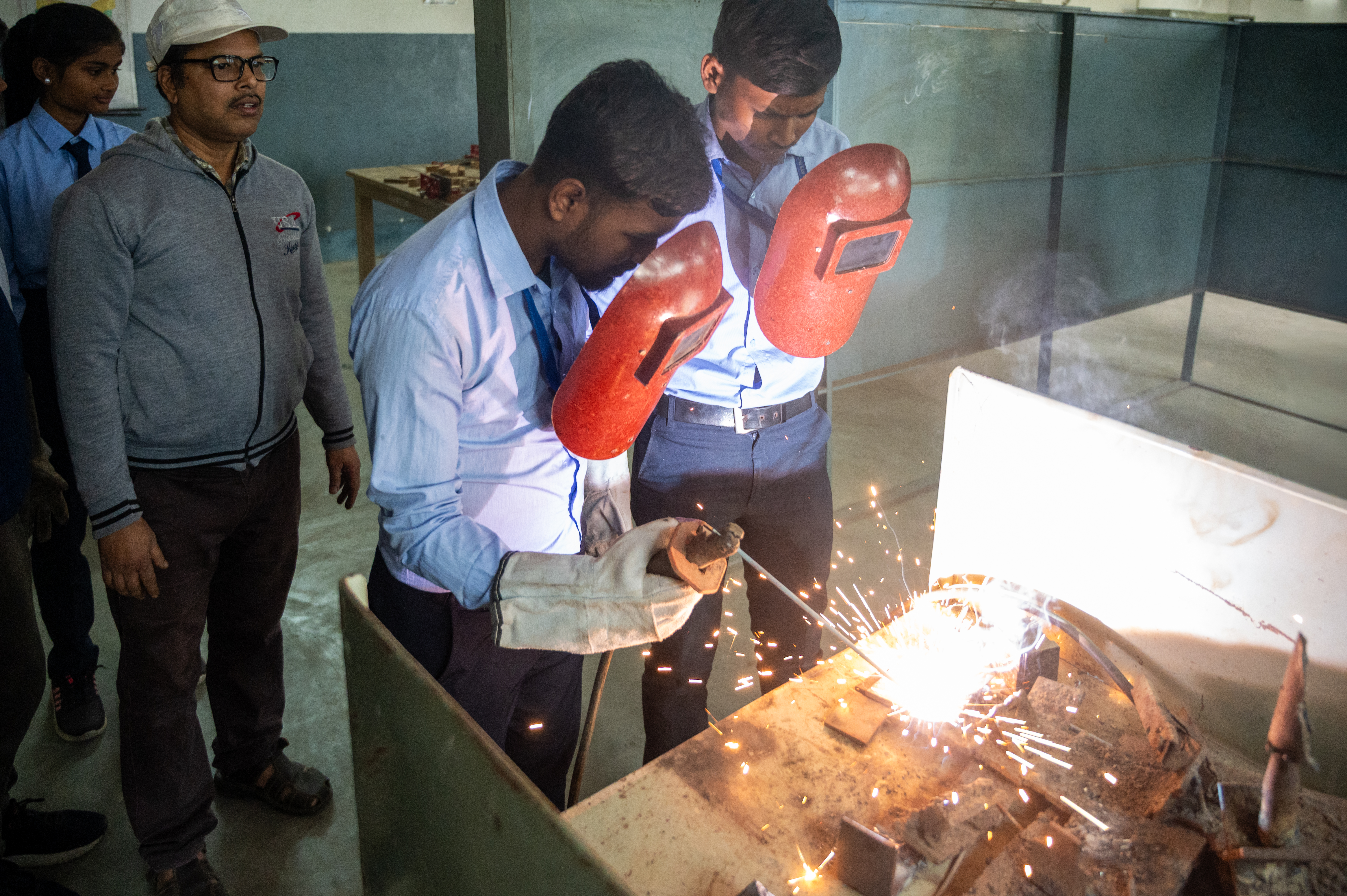 Students carrying out a mechanical workshop practical